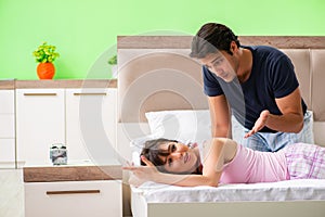 The man doing massage to his wife in bedroom