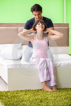 The man doing massage to his wife in bedroom