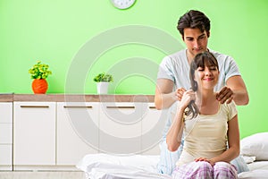 The man doing massage to his wife in bedroom