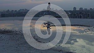 Man doing morning run on roof of his house, charge of vivacity and energy