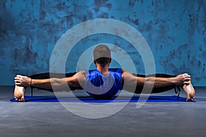 Man doing the pose of yoga lying on his back