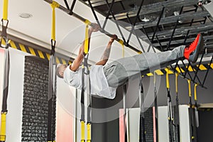 Man doing pull up exercise on horizontal bar