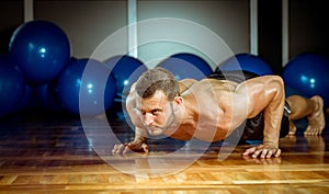 Man doing push-ups in gym