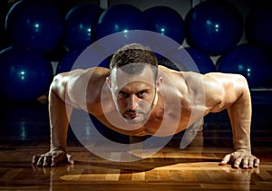 Man doing push-ups in gym