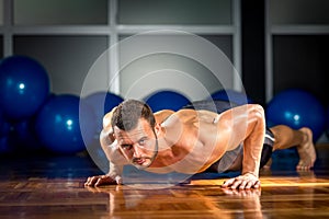 Man doing push-ups in gym
