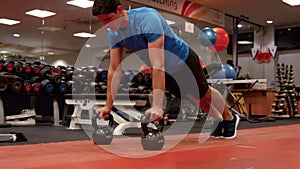 Man doing push ups in gym