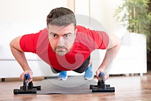 Man doing push ups at home