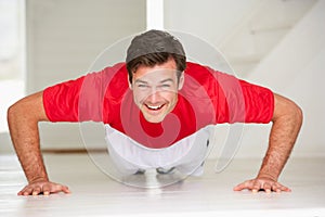 Man doing push-ups in home gym