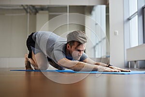 Man doing restorative yoga pose