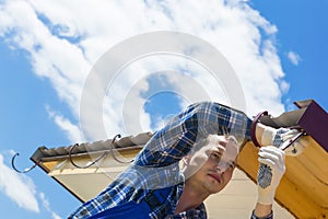 man doing on the roof repair