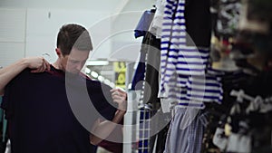 Man doing the shopping in clothing store