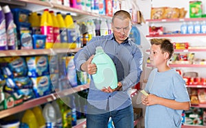 Man doing shopping with preteen boy
