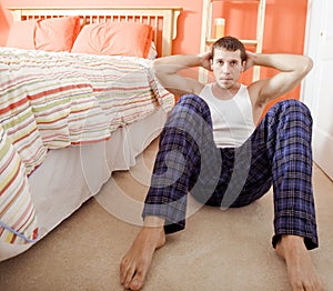 Man Doing Sit-Ups in Bedroom