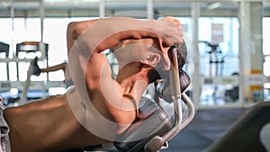 Man doing sit ups fitness exercise at gym