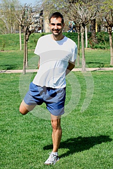 Man doing sports and stretching exercises