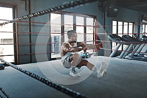 Man Doing Squats On Boxing Ring. Asian Male Sportsman Warming Up Before Intense Workout.