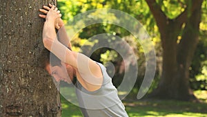 Man doing stretching excercises outdoors