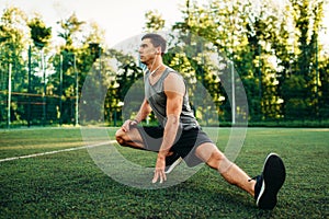 Man doing stretching exercise on outdoor workout