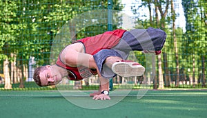 Man doing stunt trick on basketball field