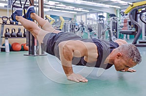 Man doing suspension training with fitness straps