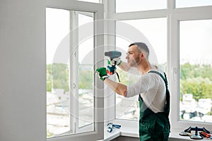 Man is doing window repair