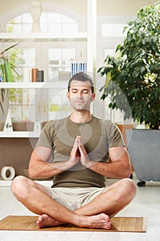 Man doing yoga exercise