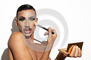 Man with drag queen makeup on white background