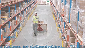 Man dragging a fork lift inside a warehouse