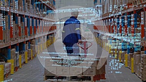 Man dragging a fork lift inside a warehouse