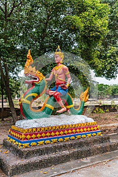 Man on dragon statue at Wang Saen Suk monastery, Bang Saen, Thailand