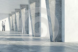 Man drawing in concrete interior