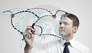 Man drawing a global network on world map