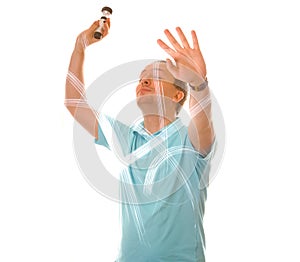 Man is drawing with light in the air