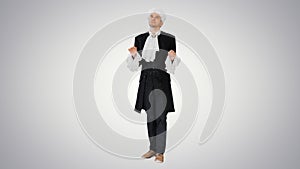 Man dressed in courtier frock coat and white wig thinking and fi