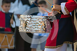 Man Dressed in Medieval Clothes Playing Drum