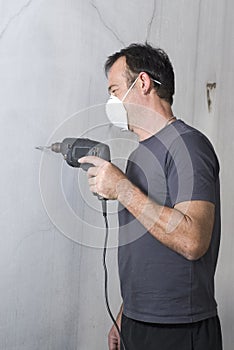 Man Drilling Hole - vertical