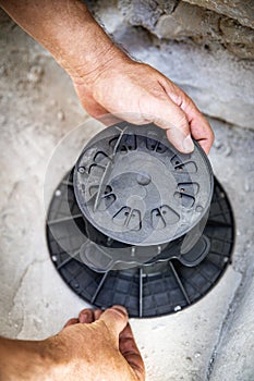 a man is drilling holes for dowels in stone or concrete