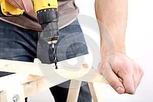 Man drilling wood. Conceptual image