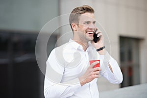 Man drink coffee speak phone urban background. Drink coffee. Each sip is moment of self care. Reasons entrepreneurs