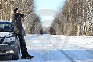 Man drink hot tea from mug outdoor in winter day