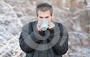 Man drink hot tea in the nature