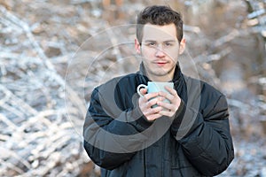 Man drink hot tea in the nature