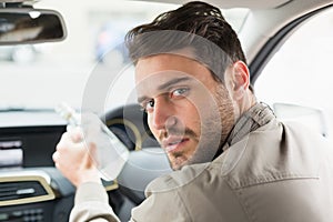Man drinking alcohol while driving
