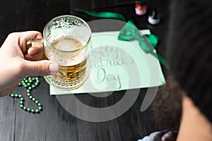 Man drinking beer and celebrating St Patrick day