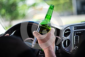 Man drinking beer while driving a car Don`t drink and drive concept. transportation and vehicle concept - man drinking alcohol