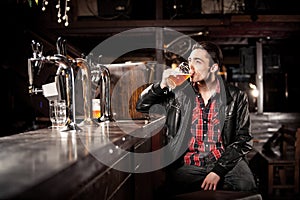 Man drinking beer in pub