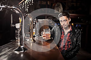 Man drinking beer in pub