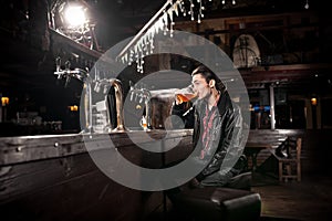 Man drinking beer in pub