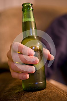 Man drinking bottle of beer
