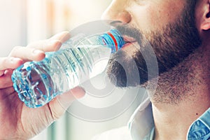 Man drinking bottle of water